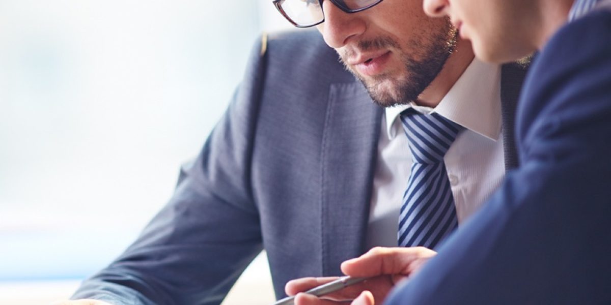 Young manager listening to his colleague explanations